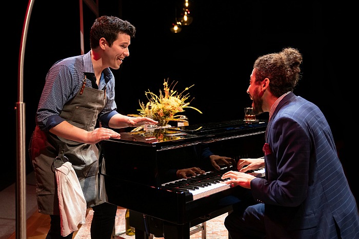 Paul and Harry singing at a piano