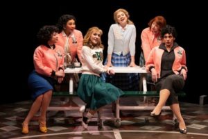 Pink Ladies at a table in Grease