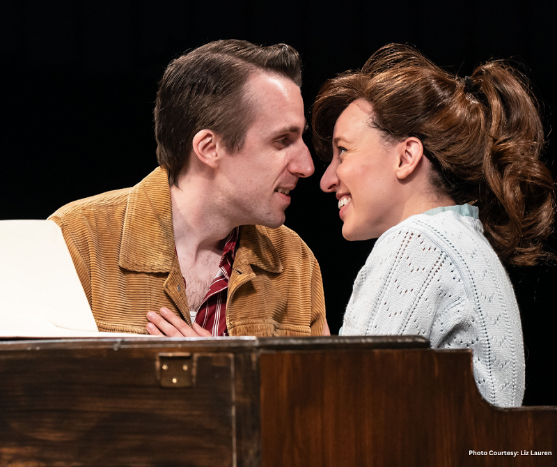 Beautiful Andrew Mueller and Kaitlyn Davis sitting at a piano at Marriott Theatre