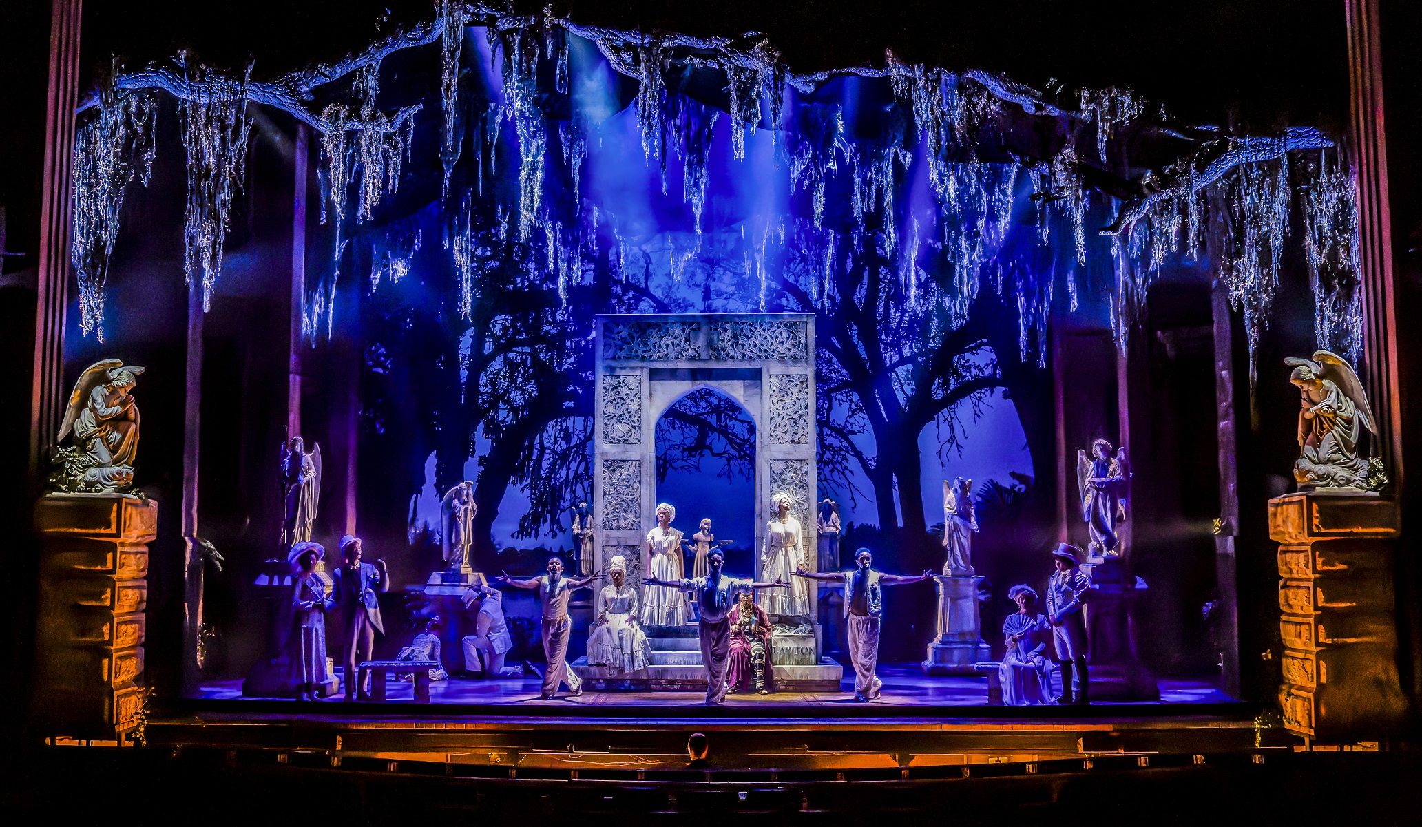 Brianna Buckley (center, on steps) and ensemble members of Midnight in the Garden of Good and Evil at Goodman Theatre